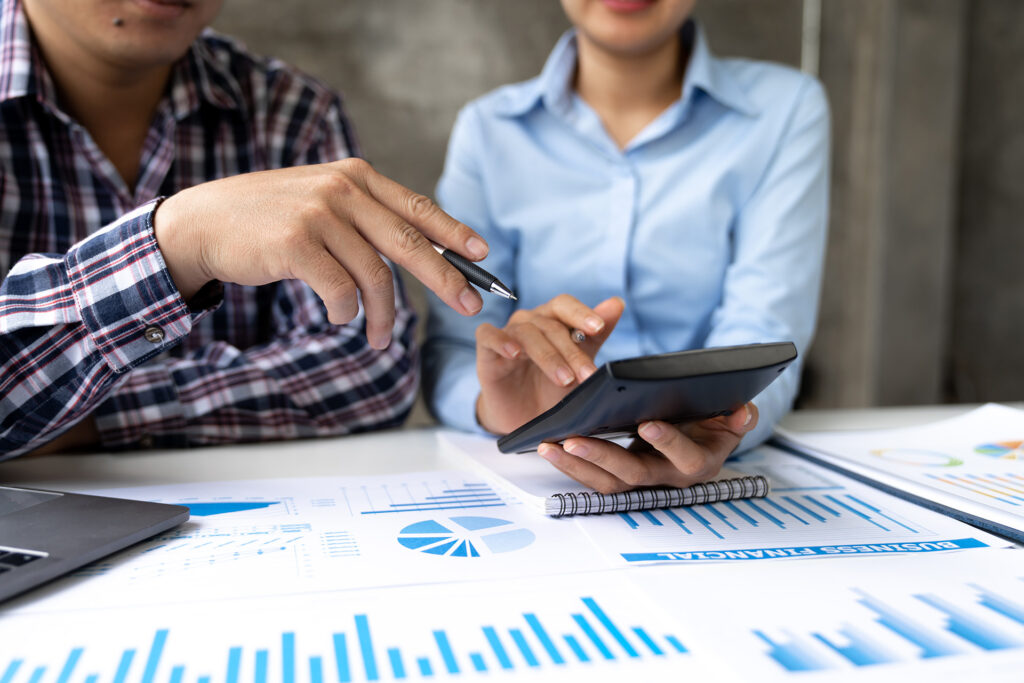 front view of hand pointing to business data chart to calculate analysis Company financial processing.